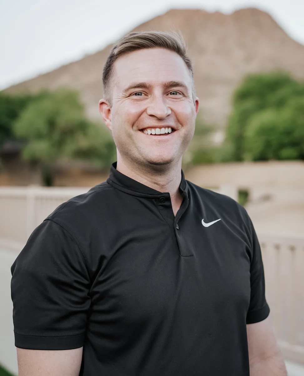 Dr. Josh Denison smiling outdoors