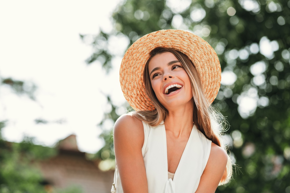 Smiling patient outdoors in warm natural light